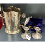 A pair of hallmarked silver candlesticks with a silver plated ice bucket, silver plated bird stand