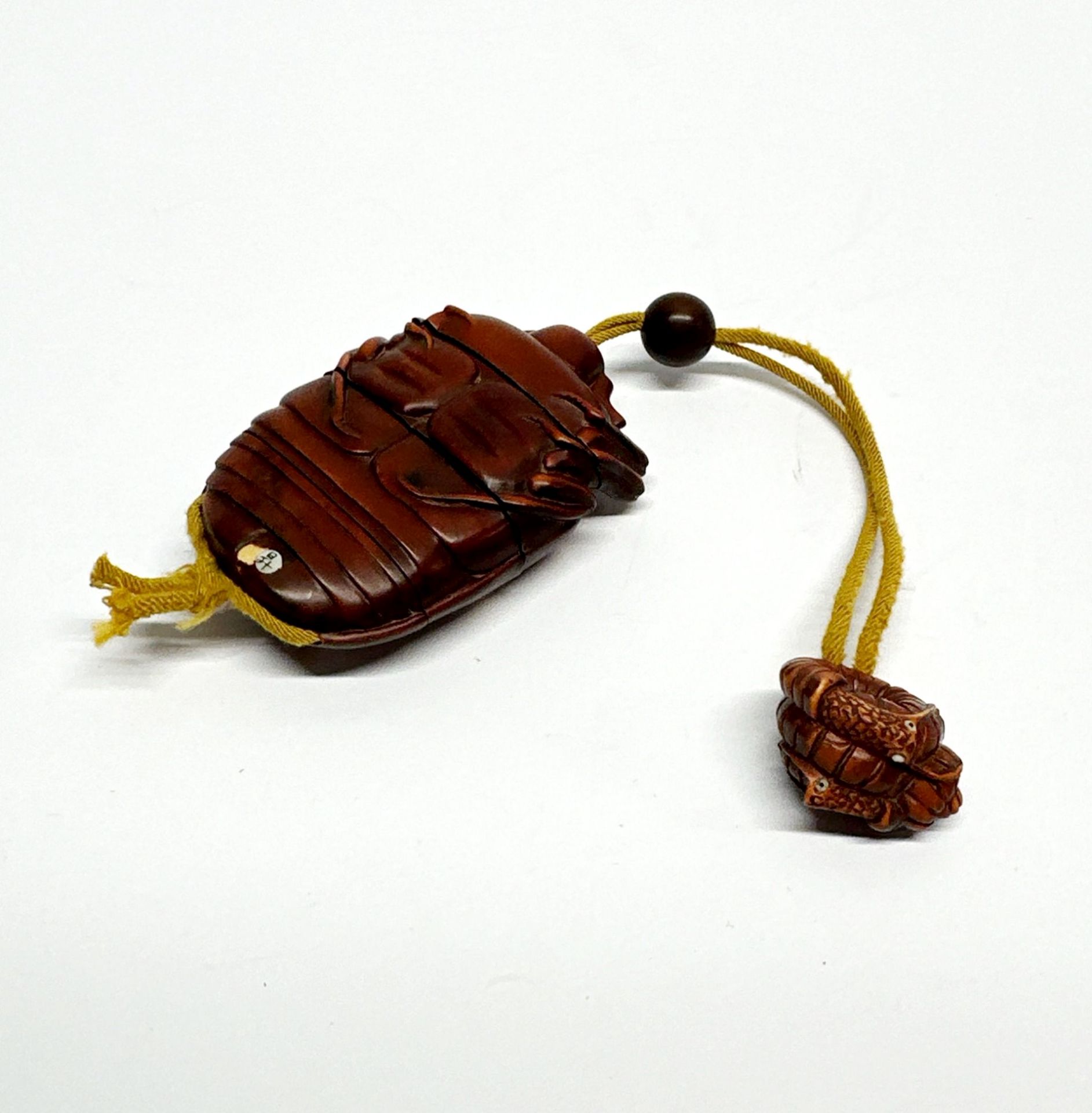 A Japanese carved fruitwood inro of a ladybird inset with mother of pearl with a shell netsuke and - Image 2 of 2