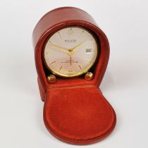 A lovely small vintage leather cased Relide travel clock, H. 6cm.