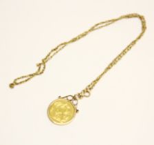 An 1886 sovereign in a 9ct gold mount with chain.