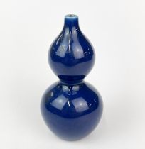 A small Chinese cobalt blue glazed porcelain gourd shaped vase, H. 11.5cm.