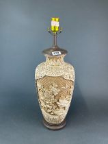 A Chinese cream cinnabar style vase mounted as a lamp base, H. 56cm.