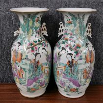 A pair of 19th C. Chinese hand enamelled porcelain vases, H. 43cm. One A/F to handle.