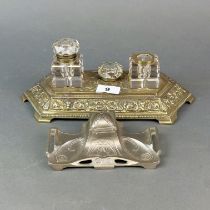 An early 20th C. brass and cut glass desk stand (detached lid to one bottle) , W .31cm. together