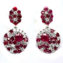 A pair of 925 silver drop earrings set with rubies and white stones, L. 3cm.