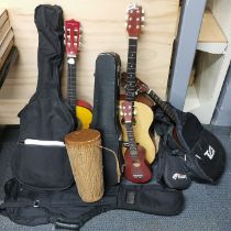 A group of mixed guitars and other instruments.
