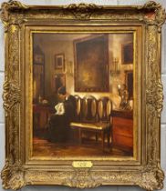 A gilt framed oil on canvas interior scene after C. Holsoe (1863-1935), frame size 68 x 77cm.