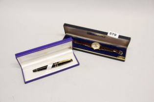 A gent's vintage Benrus gold plated wristwatch together with a boxed Waterman ballpoint pen.