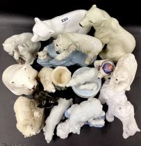 A group of porcelain and other polar bear figures, tallest 24cm.