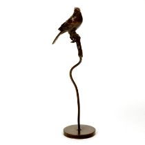 A Japanese bronze model of a bird on a perch, H. 16.5cm.