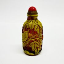 A Chinese carved Peking cameo glass snuff bottle, H. 8cm.