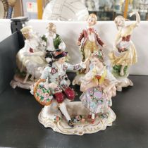 A group of four porcelain figurines, tallest 18cm.