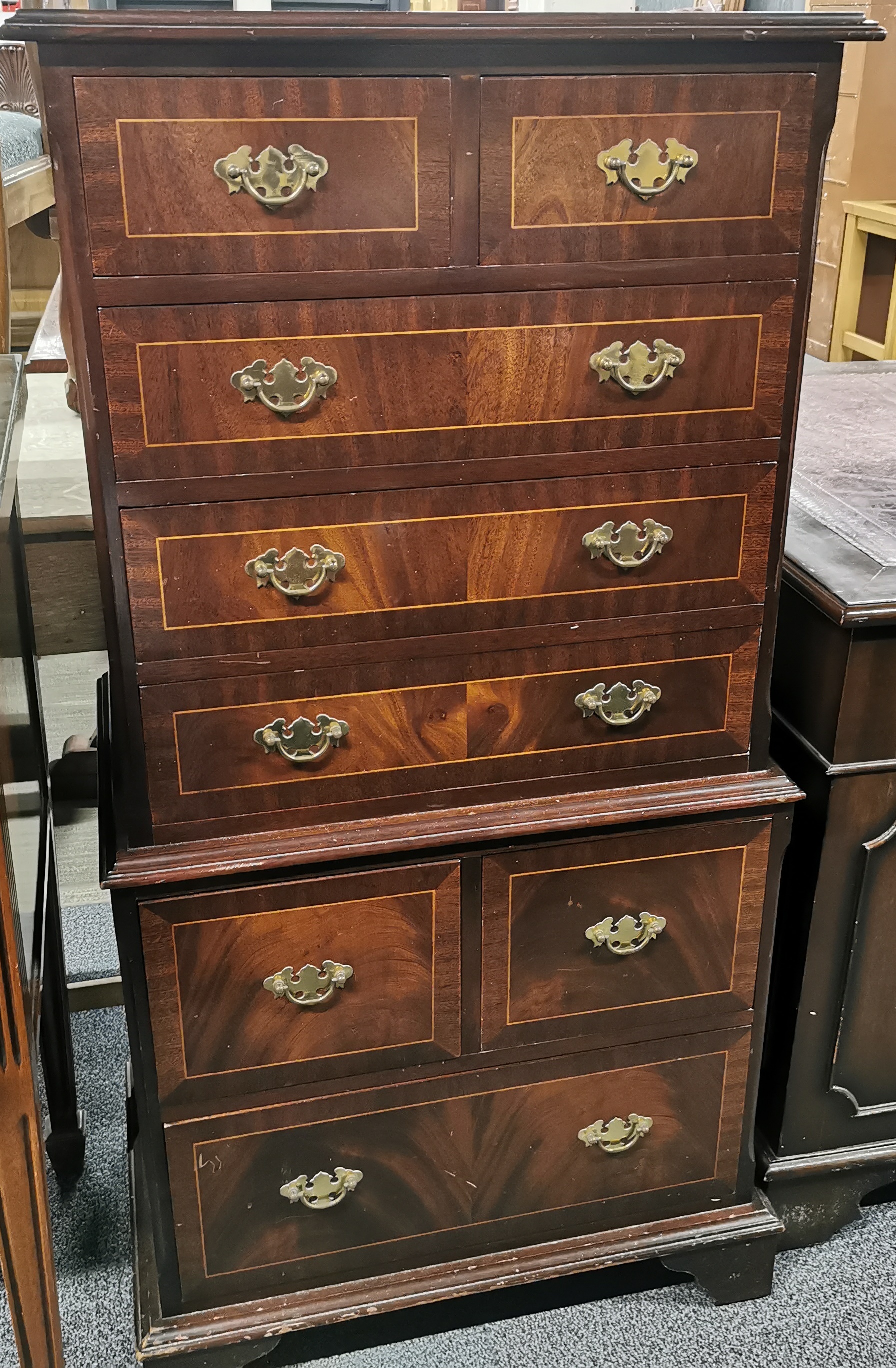 A cross banded and inlaid mahogany eight drawer chest on chest, 123 x 65 x 40cm.