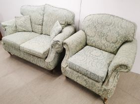 A two seater settee/ sofa on castors together with a matching armchair, settee H. 100cm D. 90cm W.