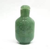 A Chinese carved serpentine snuff bottle, H. 10cm.