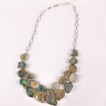An impressive silver necklace inset with rock crystal geodes.