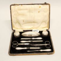 A cased hallmarked silver manicure set.