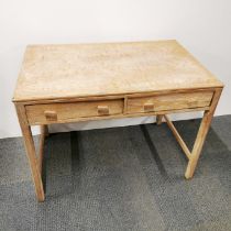 A light oak two drawer writing desk, 103 x 77 x 65cm.