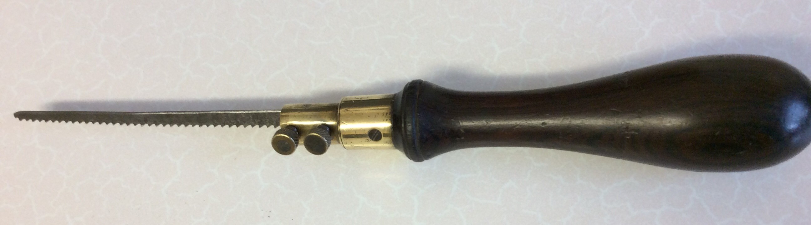 A simple rosewood stick with a brass section set just below the handle. Two small bolts hold the - Image 5 of 8