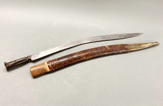 An Eastern Yataghan sword with wood and leather covered sheath, L. 86cm.