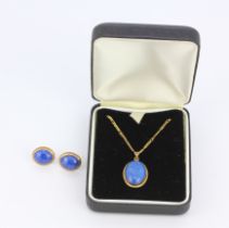 A 9ct lapis lazuli set pendant and chain together with matching earrings.