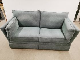 A comfortable teal two seater settee, L. 185cm D. 90cm H. 90cm.