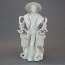 A studio pottery figure of an Oriental water carrier signed Ricci, H. 34cm.