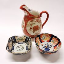 An early 20th century Japanese porcelain jug, H. 22cm. Together with an imari porcelain bowl and a