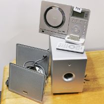 A TEIC compact disc player and speakers.