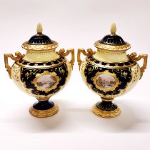 A pair of Coalport fine hand painted jars and covers, H.23cm. A/F