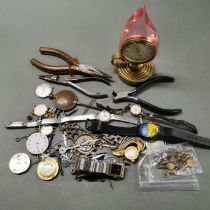 A quantity of watches, watch parts and tools.