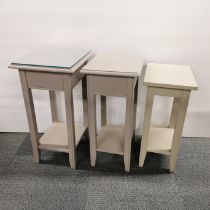 Three handmade painted two tier side tables, graduating heights and one with plate glass top,