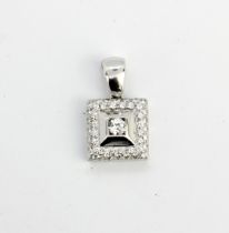 A white metal (tested 18ct gold) pendant set with diamonds, L. 2.3cm.