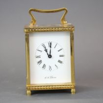 An English gilt brass carriage clock, H. 14cm. Front glass missing.