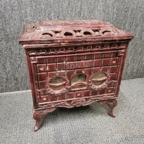 An antique French 'Phebus' enamelled wood burning stove, 50 x 55 x 38cm.