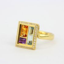 A heavy 18ct yellow gold ring set with blue topaz, citrine, amethyst and diamonds, (R).