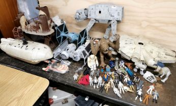A collection of large Star Wars models and figures.