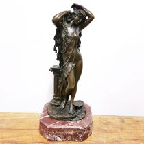 A classical bronze figure on a red marble base, H. 30cm.