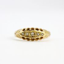 An 18ct yellow gold diamond set ring, (O).