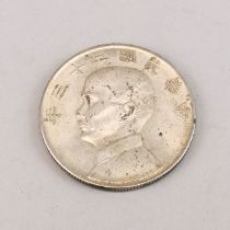 A 1923 Chinese "Dollar" coin featuring Sun Yat Sen, collected at the time. See lot 781.