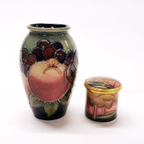 A small Moorcroft porcelain vase, H. 10.3cm. Together with a Moorcroft enamelled box, H. 4.5cm.