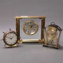 A vintage brass quartz mantel clock, together with two further brass clocks.