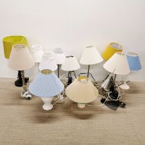 A large group of table lamps and shades.