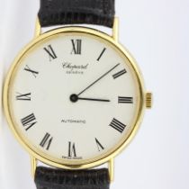 A gentleman's 18ct yellow gold Chopard automatic wrist watch on a leather strap, with paperwork. W.