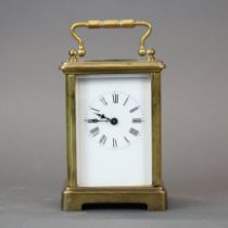 A brass carriage clock, H. 14cm. Understood to be in working order.