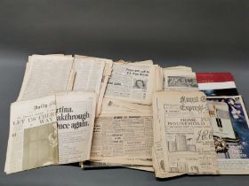 A quantity of World War II newspapers.