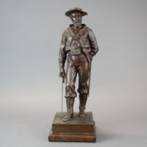 A lovely cast bronze figure of a sailor, cap band reading 'H.M.S Excellent'. Mounted on a wooden