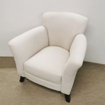 A cream upholstered armchair, H. 85cm.