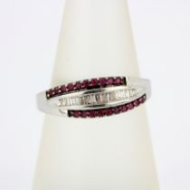 A 9ct white gold ring set with rubies and diamonds, (O).