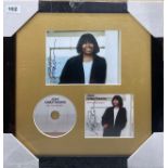 Autograph interest: A framed autographed photograph and CD cover by Joan Armatrading. Frame size